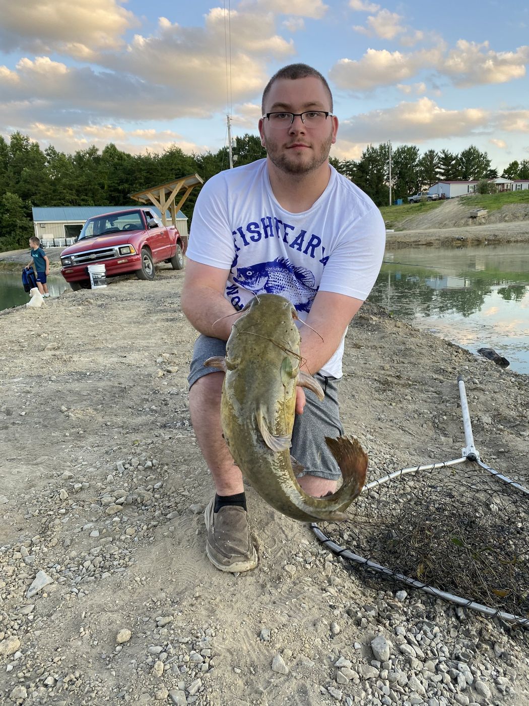 Cameron holding a catfish he caught